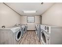 312-1712 38 Street Se, Calgary, AB  - Indoor Photo Showing Laundry Room 