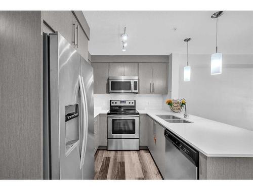 2310-302 Skyview Ranch Drive Ne, Calgary, AB - Indoor Photo Showing Kitchen With Stainless Steel Kitchen With Double Sink With Upgraded Kitchen