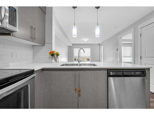 2310-302 Skyview Ranch Drive Ne, Calgary, AB - Indoor Photo Showing Kitchen With Stainless Steel Kitchen With Double Sink With Upgraded Kitchen