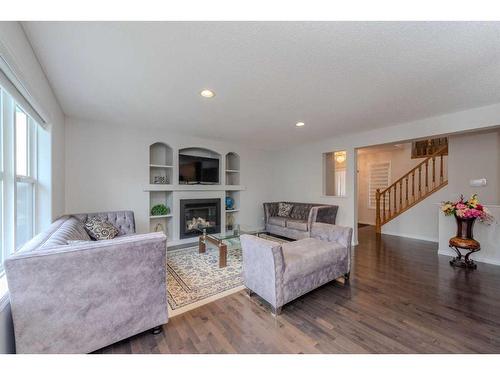 316 Morningside Crescent Sw, Airdrie, AB - Indoor Photo Showing Living Room With Fireplace