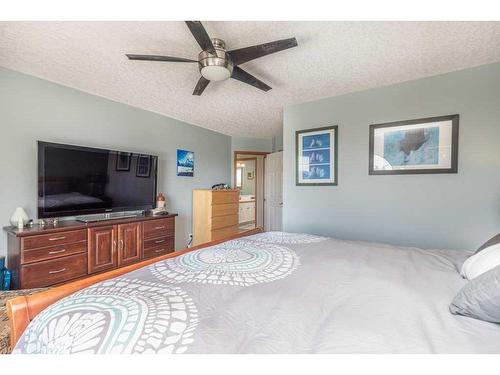 1112 High Country Drive Nw, High River, AB - Indoor Photo Showing Bedroom