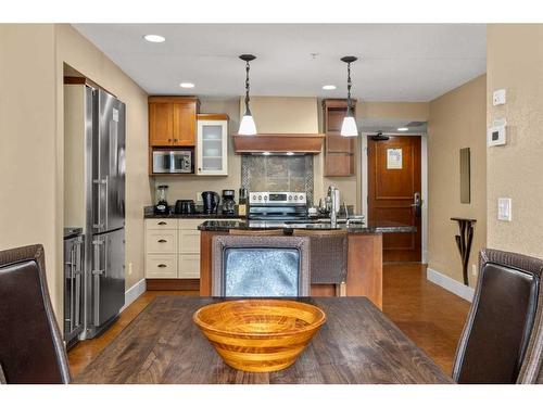 107Bf-187 Kananaskis Way, Canmore, AB - Indoor Photo Showing Kitchen With Stainless Steel Kitchen