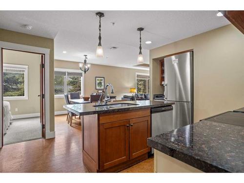 107Bf-187 Kananaskis Way, Canmore, AB - Indoor Photo Showing Kitchen With Double Sink