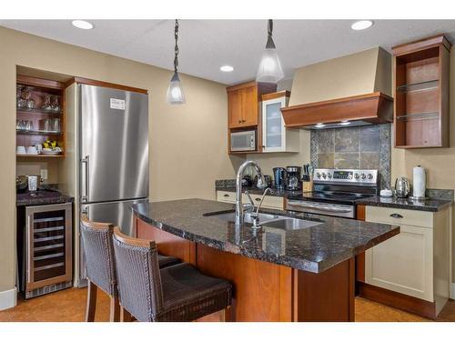 107Bf-187 Kananaskis Way, Canmore, AB - Indoor Photo Showing Kitchen With Stainless Steel Kitchen With Double Sink