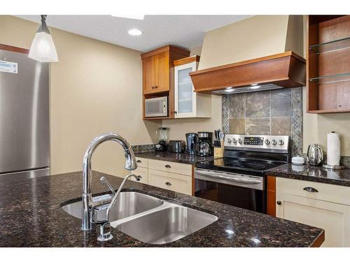 107Bf-187 Kananaskis Way, Canmore, AB - Indoor Photo Showing Kitchen With Stainless Steel Kitchen With Double Sink