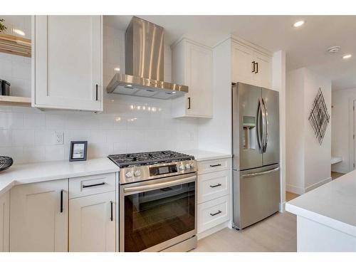 23 Hoover Place Sw, Calgary, AB - Indoor Photo Showing Kitchen With Stainless Steel Kitchen With Upgraded Kitchen