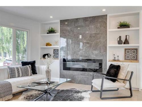 23 Hoover Place Sw, Calgary, AB - Indoor Photo Showing Living Room With Fireplace