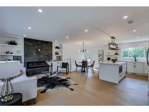 23 Hoover Place Sw, Calgary, AB - Indoor Photo Showing Living Room With Fireplace