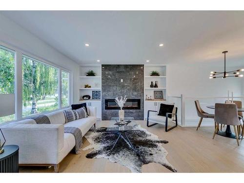 23 Hoover Place Sw, Calgary, AB - Indoor Photo Showing Living Room With Fireplace