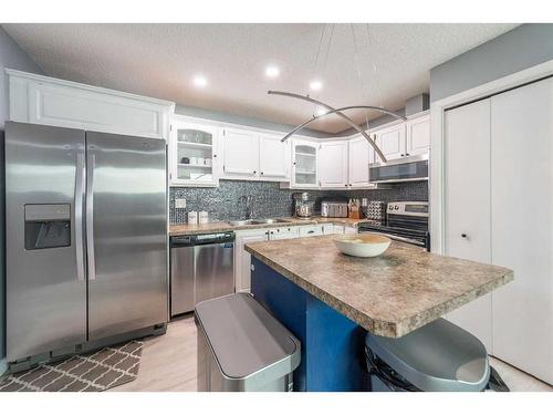 7846 20A Street Se, Calgary, AB - Indoor Photo Showing Kitchen With Stainless Steel Kitchen