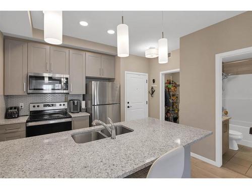 312-30 Mahogany Mews Se, Calgary, AB - Indoor Photo Showing Kitchen With Stainless Steel Kitchen With Double Sink With Upgraded Kitchen