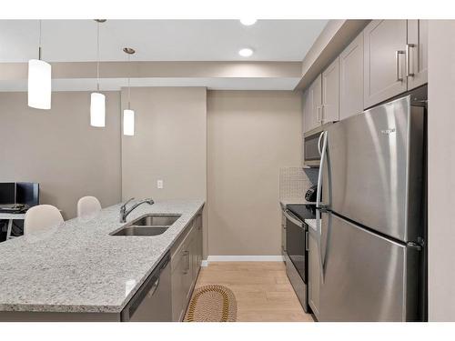 312-30 Mahogany Mews Se, Calgary, AB - Indoor Photo Showing Kitchen With Stainless Steel Kitchen With Double Sink