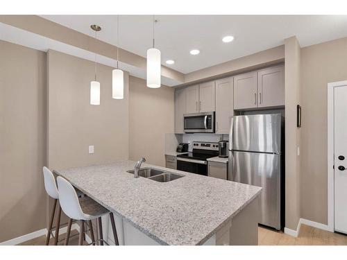 312-30 Mahogany Mews Se, Calgary, AB - Indoor Photo Showing Kitchen With Stainless Steel Kitchen With Double Sink