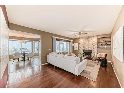 105 Hawkbury Close Nw, Calgary, AB - Indoor Photo Showing Living Room With Fireplace