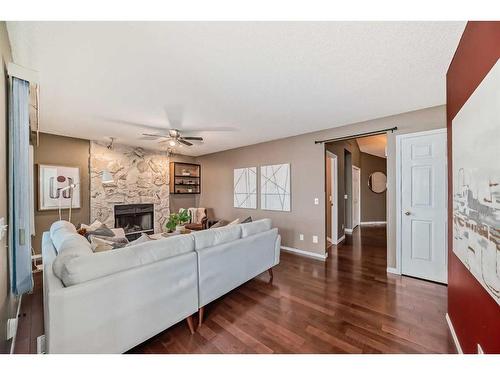 105 Hawkbury Close Nw, Calgary, AB - Indoor Photo Showing Living Room With Fireplace