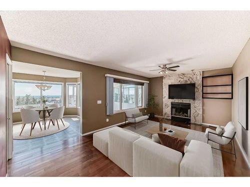 105 Hawkbury Close Nw, Calgary, AB - Indoor Photo Showing Living Room With Fireplace