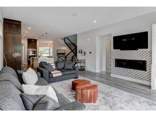 515 30 Avenue Nw, Calgary, AB - Indoor Photo Showing Living Room With Fireplace