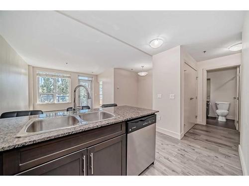 220-955 Mcpherson Road Ne, Calgary, AB - Indoor Photo Showing Kitchen With Double Sink