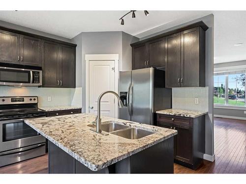 396 Rainbow Falls Drive, Chestermere, AB - Indoor Photo Showing Kitchen With Double Sink With Upgraded Kitchen