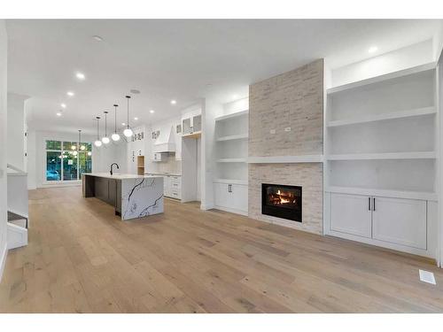 440 20 Avenue Nw, Calgary, AB - Indoor Photo Showing Living Room With Fireplace