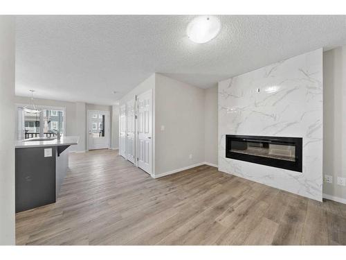 1485 148 Avenue Nw, Calgary, AB - Indoor Photo Showing Living Room With Fireplace