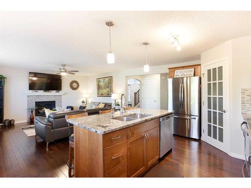 157 Sherwood Circle Nw, Calgary, AB - Indoor Photo Showing Kitchen With Fireplace With Double Sink