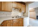 61-116 Silver Crest Drive Nw, Calgary, AB  - Indoor Photo Showing Kitchen With Double Sink 