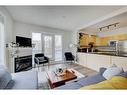 205-138 18 Avenue Se, Calgary, AB  - Indoor Photo Showing Living Room With Fireplace 