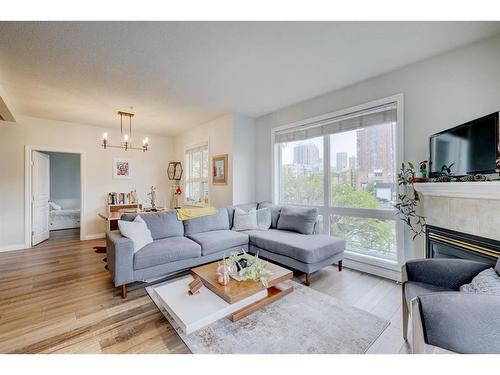 205-138 18 Avenue Se, Calgary, AB - Indoor Photo Showing Living Room With Fireplace