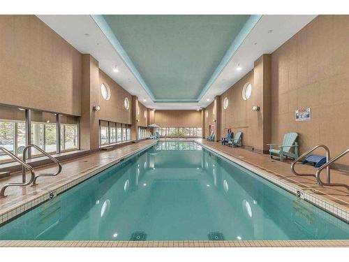 907-55 Spruce Place Sw, Calgary, AB - Indoor Photo Showing Other Room With In Ground Pool