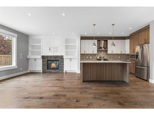 414 23 Avenue Nw, Calgary, AB - Indoor Photo Showing Other Room With Fireplace