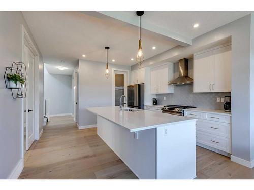 263 Precedence Hill, Cochrane, AB - Indoor Photo Showing Kitchen With Upgraded Kitchen