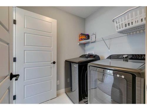 263 Precedence Hill, Cochrane, AB - Indoor Photo Showing Laundry Room