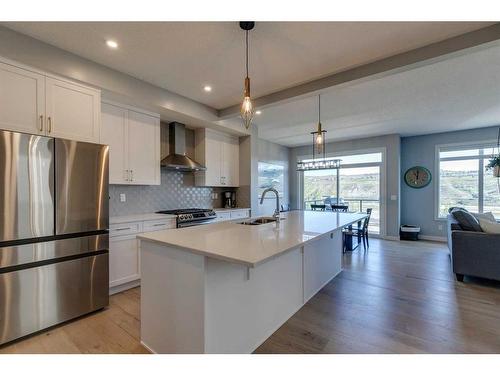 263 Precedence Hill, Cochrane, AB - Indoor Photo Showing Kitchen With Upgraded Kitchen