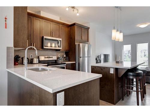 409 Legacy Boulevard, Calgary, AB - Indoor Photo Showing Kitchen With Stainless Steel Kitchen With Double Sink With Upgraded Kitchen