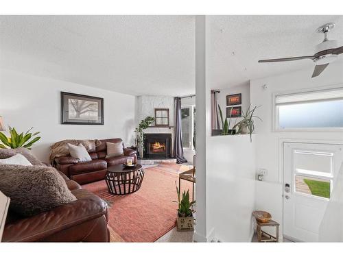 268 Fallswater Road Ne, Calgary, AB - Indoor Photo Showing Living Room With Fireplace