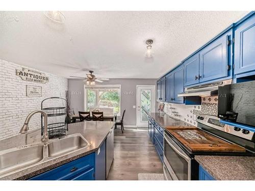 128 Somercrest Manor Sw, Calgary, AB - Indoor Photo Showing Kitchen With Double Sink