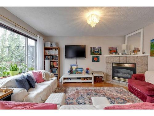 206 Harvest Creek Close Ne, Calgary, AB - Indoor Photo Showing Living Room With Fireplace