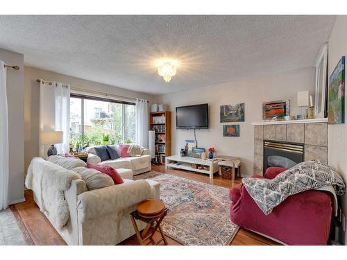 206 Harvest Creek Close Ne, Calgary, AB - Indoor Photo Showing Living Room With Fireplace