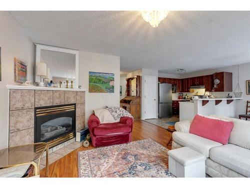 206 Harvest Creek Close Ne, Calgary, AB - Indoor Photo Showing Living Room With Fireplace