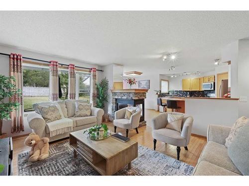 899 Somerset Drive Sw, Calgary, AB - Indoor Photo Showing Living Room With Fireplace