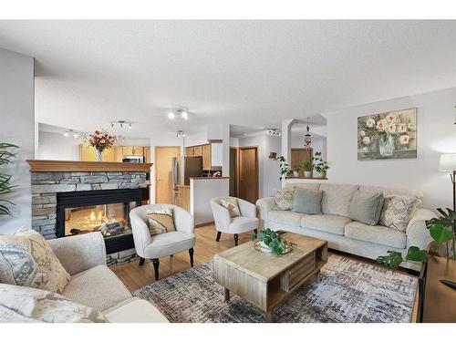 899 Somerset Drive Sw, Calgary, AB - Indoor Photo Showing Living Room With Fireplace