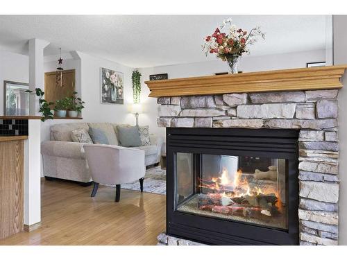 899 Somerset Drive Sw, Calgary, AB - Indoor Photo Showing Living Room With Fireplace