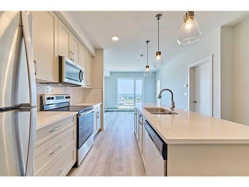 401-200 Shawnee Square, Calgary, AB - Indoor Photo Showing Kitchen With Double Sink With Upgraded Kitchen