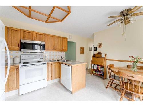 4719 69 Street Nw, Calgary, AB - Indoor Photo Showing Kitchen With Double Sink