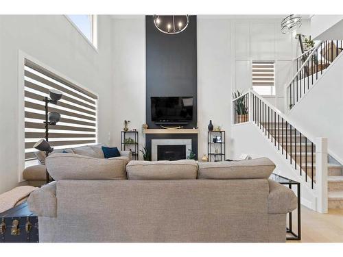 40 South Shore Manor, Chestermere, AB - Indoor Photo Showing Living Room With Fireplace