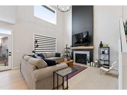 40 South Shore Manor, Chestermere, AB - Indoor Photo Showing Living Room With Fireplace