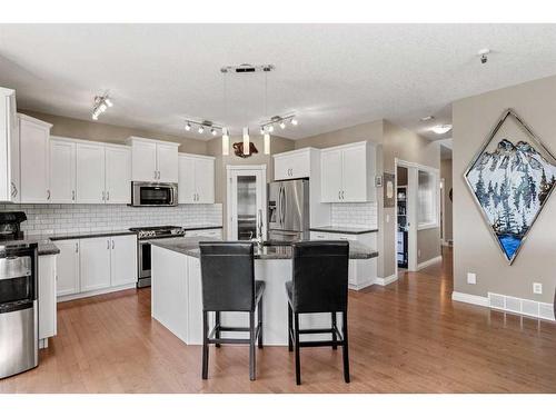 62 Crystal Green Way, Okotoks, AB - Indoor Photo Showing Kitchen With Stainless Steel Kitchen With Double Sink With Upgraded Kitchen