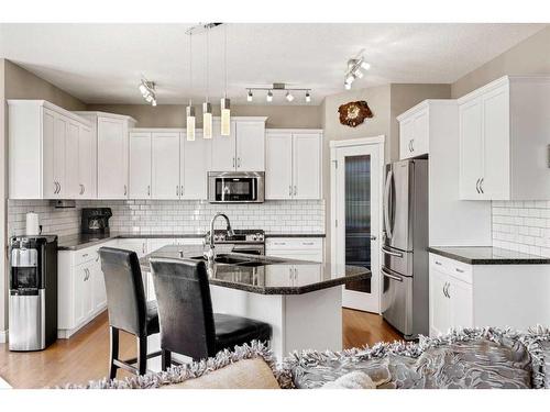 62 Crystal Green Way, Okotoks, AB - Indoor Photo Showing Kitchen With Stainless Steel Kitchen With Double Sink With Upgraded Kitchen