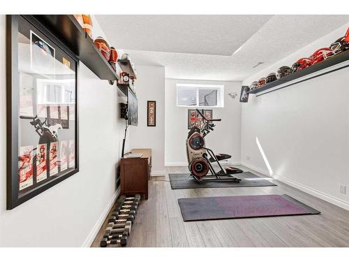 62 Crystal Green Way, Okotoks, AB - Indoor Photo Showing Gym Room